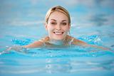 Young Woman Swimming In Pool