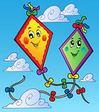 Two flying kites on blue sky