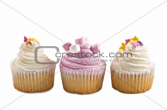 Pink and cream cupcakes against a white background