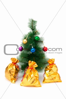 Christmas tree and golden sacks on white