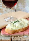 sandwich of white bread with mozzarella cheese and a glass of wine