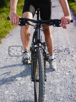 young man training on mountain bike 