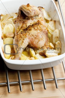 chicken baked with onion and potatoes