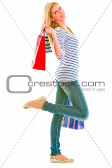 Happy teen girl with shopping bags
