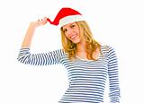 Playful lovely teen girl in Santa hat
