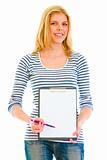 Smiling teen girl with clipboard and pen for signing 
