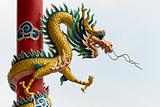 Golden Chinese Dragon Wrapped around red pole