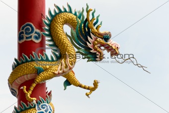 Golden Chinese Dragon Wrapped around red pole