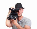 professional videographer in hat holding a camera - isolated on white