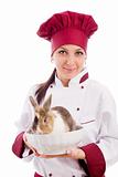 Chef with dwarf rabbit inside a bowl