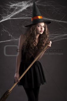 cute girl dressed as halloween witch