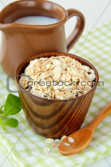 Oat flakes and milk - concept of a healthy breakfast