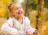 Little girl outdoors in autumn