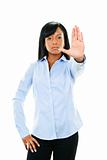 Serious young woman giving stop gesture
