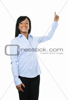 Smiling young woman pointing up
