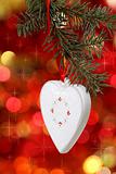 Christmas white heart with against blurred background