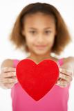 Young Girl Holding Heart