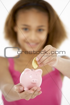 Young Girl Holding Piggy Bank