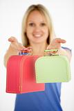 Woman Holding Two Suitcases