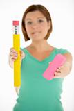 Woman Holding Big Pencil And Eraser