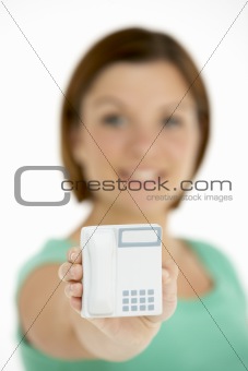 Woman Holding Model Telephone