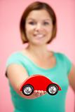 Woman Holding Toy Car