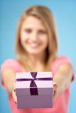 Teenage Girl Holding Gift Wrapped Box