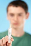 Teenage Boy Holding Syringe