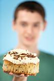 Teenage Boy Holding Cream Cake