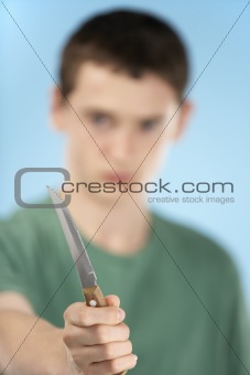 Teenage Boy Holding Knife 