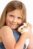 Young Girl Holding Pet Guinea Pig