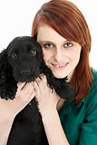 Girl With Black Spaniel Puppy