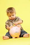 Toddler In Studio With Piggy Bank