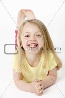 Young Girl Lying On Stomach In Studio