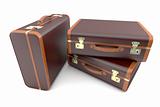 Three brown vintage suitcases