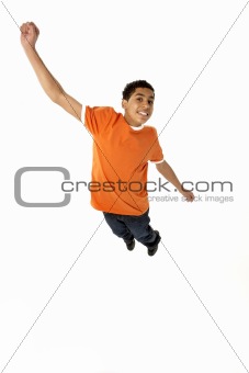 Young Boy Leaping In Studio