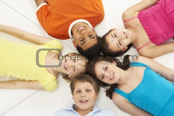 Overhead View Of Five Young Children In Studio