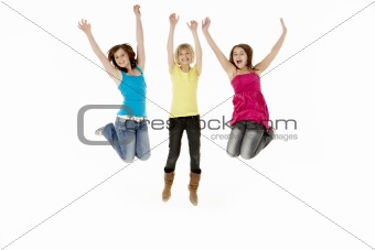 Group Of Three Young Girls Leaping In Air