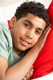 Young Boy Relaxing On Sofa