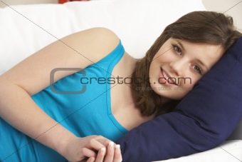 Young Girl Relaxing On Sofa