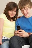 Teenage Couple Reading Text Message