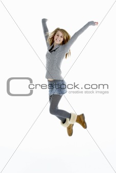 Full Length Portrait Of Jumping Teenage Girl