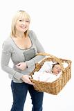 Newborn Baby Held In Basket By Mother