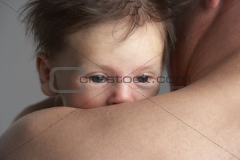 Father Hugging Newborn Baby
