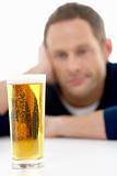 Man Looking At Glass Of Beer