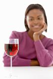 Woman Looking At Glass Of Wine