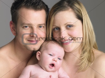 Family Holding Newborn Baby