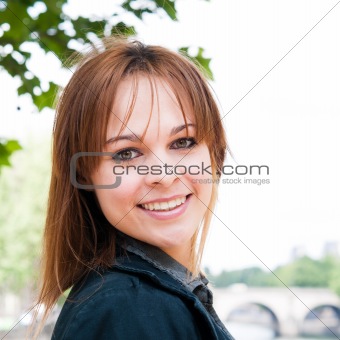 beautiful attractive young woman smiling while looking back 