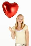 Teenage Girl Holding Heart-Shaped Balloon
