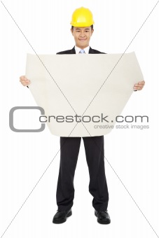 smiling asian  architects holding a set of building plans isolated on a white background